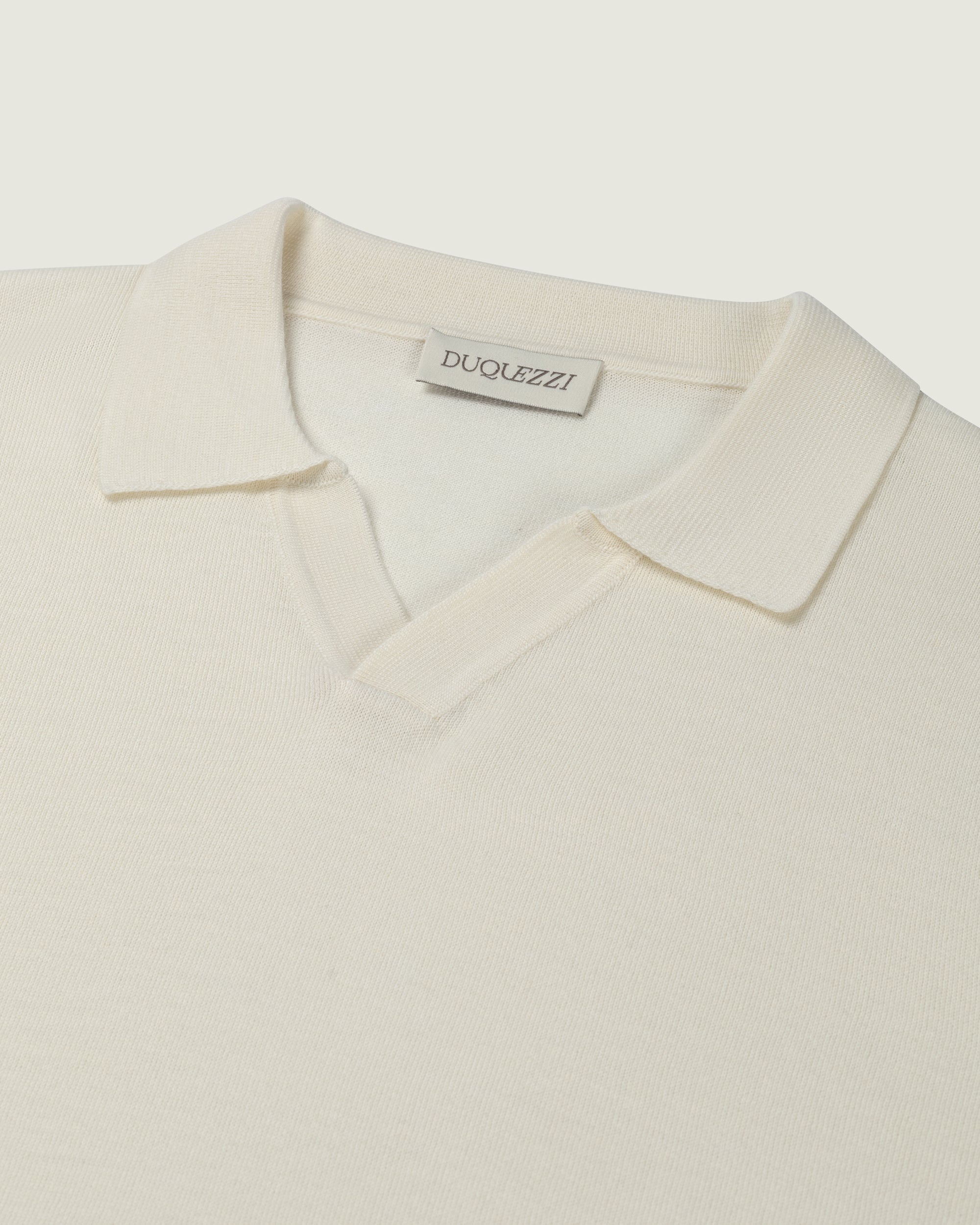 DUQUEZZI MERINO BUTTONLESS POLO | Off-White